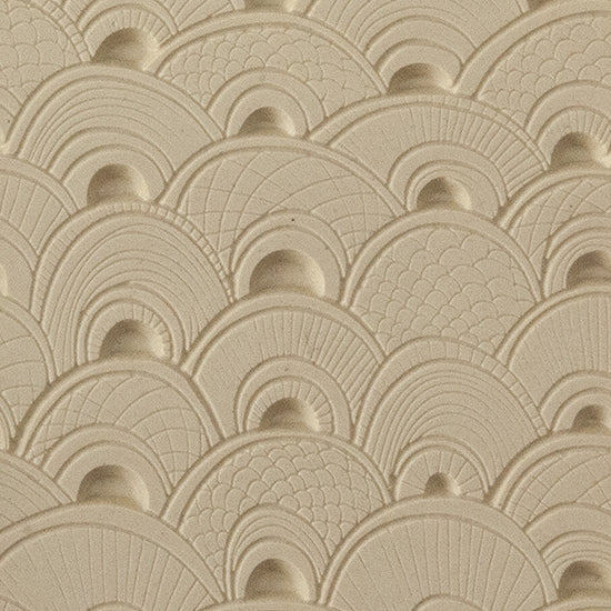 Texture Tile - Seashell Sunrise Embossed. Beige Texture Tiles are flexible, washable and can be used with any soft clay. Spritz with CoolSlip or dust on Dry Powder Release for stick-free impressions when using metal clay and polymer clay.