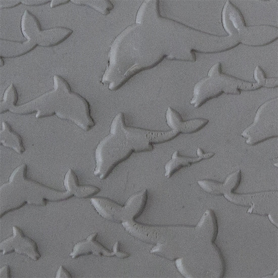 Texture Tile - Flying Dolphins Embossed sample rolled into clay