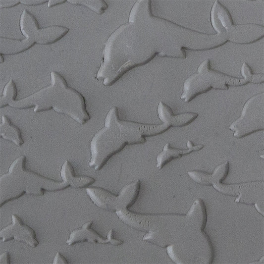 Texture Tile - Flying Dolphins Embossed sample rolled into clay