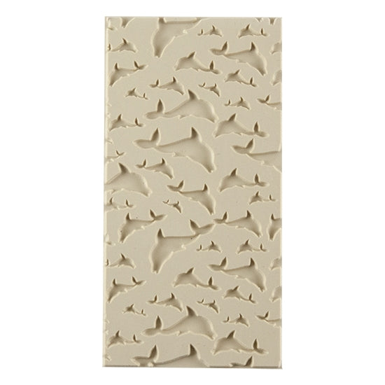 Texture Tile - Flying Dolphins Embossed. Beige Texture Tiles are flexible, washable and can be used with any soft clay. Spritz with CoolSlip or dust on Dry Powder Release for stick-free impressions when using metal clay and polymer clay.