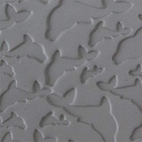 Texture Tile - Flying Dolphins sample rolled into clay