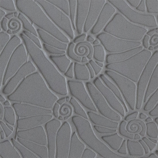 Texture Tile - Snail Parade Embossed sample rolled into clay