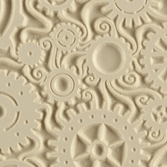 Texture Tile - Steampunk Swirl. Beige Texture Tiles are flexible, washable and can be used with any soft clay. Spritz with CoolSlip or dust on Dry Powder Release for stick-free impressions when using metal clay and polymer clay.