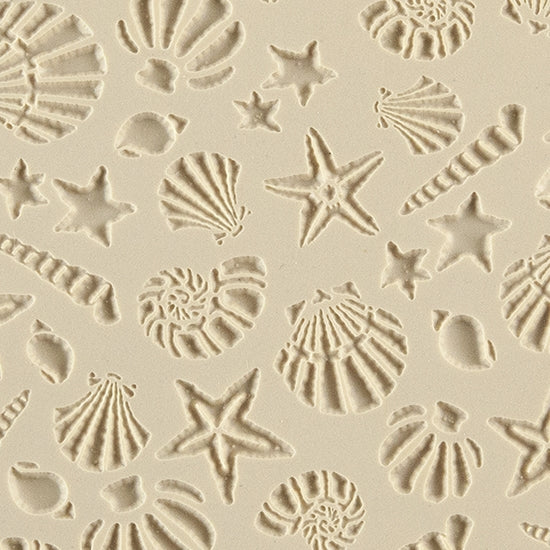 Texture Tile - Seashells. Beige Texture Tiles are flexible, washable and can be used with any soft clay. Spritz with CoolSlip or dust on Dry Powder Release for stick-free impressions when using metal clay and polymer clay.