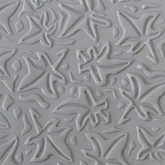 Texture Tile - Woodcut Leaves Embossed sample rolled into clay