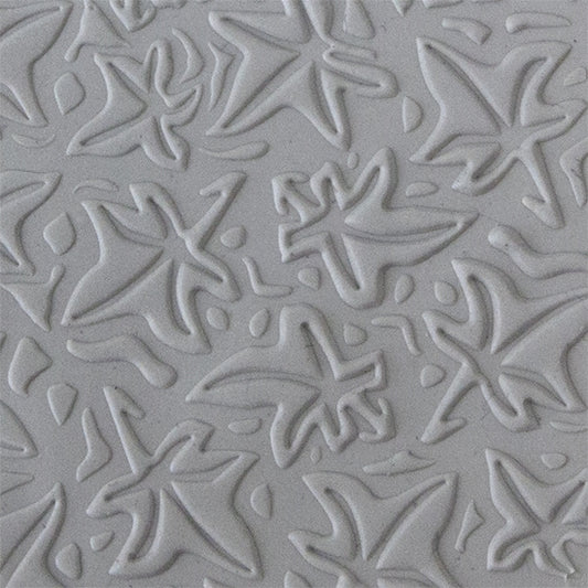 Texture Tile - Woodcut Leaves Embossed sample rolled into clay