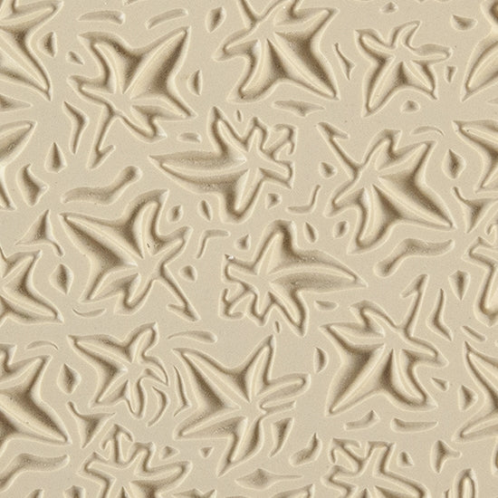 Texture Tile - Woodcut Leaves Embossed. Beige Texture Tiles are flexible, washable and can be used with any soft clay. Spritz with CoolSlip or dust on Dry Powder Release for stick-free impressions when using metal clay and polymer clay.