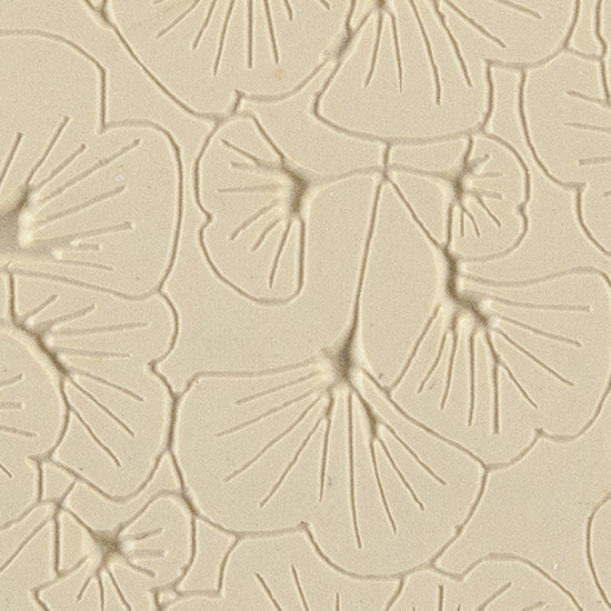 Texture Tile - Gingko Leaves Embossed. Beige Texture Tiles are flexible, washable and can be used with any soft clay. Spritz with CoolSlip or dust on Dry Powder Release for stick-free impressions when using metal clay and polymer clay.