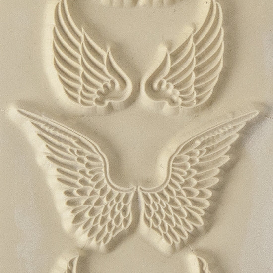 Texture Tile - Angel Wings. Beige Texture Tiles are flexible, washable and can be used with any soft clay. Spritz with CoolSlip or dust on Dry Powder Release for stick-free impressions when using metal clay and polymer clay.