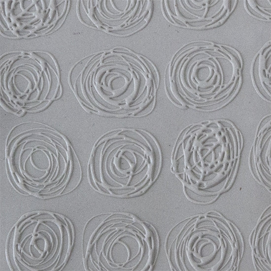 Texture Tile - Tissue Flowers Fineline sample rolled into clay