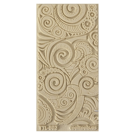 Texture Tile - Swirly Hearts Embossed. Beige Texture Tiles are flexible, washable and can be used with any soft clay. Spritz with CoolSlip or dust on Dry Powder Release for stick-free impressions when using metal clay and polymer clay.