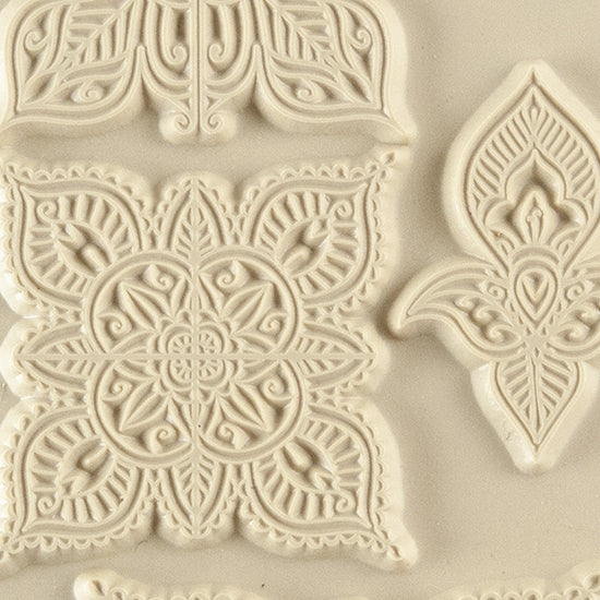 Texture Tile - Mehndi Elements. Beige Texture Tiles are flexible, washable and can be used with any soft clay. Spritz with CoolSlip or dust on Dry Powder Release for stick-free impressions when using metal clay and polymer clay.