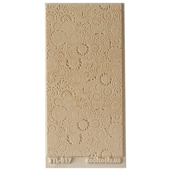 Texture Tile - Kaleidoscope Overload. Beige Texture Tiles are flexible, washable and can be used with any soft clay. Spritz with CoolSlip or dust on Dry Powder Release for stick-free impressions when using metal clay and polymer clay.