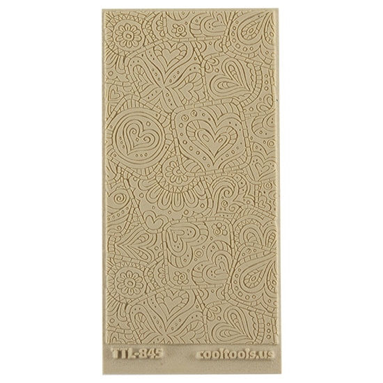 Texture Tile - Doodling Hearts Fineline. Beige Texture Tiles are flexible, washable and can be used with any soft clay. Spritz with CoolSlip or dust on Dry Powder Release for stick-free impressions when using metal clay and polymer clay.