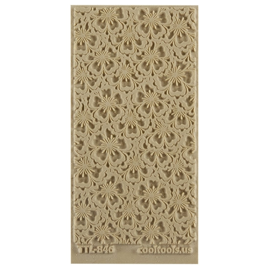 Texture Tile - Flowering Fields. Beige Texture Tiles are flexible, washable and can be used with any soft clay. Spritz with CoolSlip or dust on Dry Powder Release for stick-free impressions when using metal clay and polymer clay.