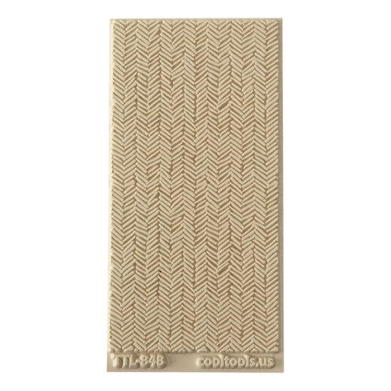 Texture Tile - Smudged Herringbone. Beige Texture Tiles are flexible, washable and can be used with any soft clay. Spritz with CoolSlip or dust on Dry Powder Release for stick-free impressions when using metal clay and polymer clay.