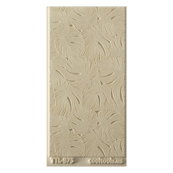 Texture Tile - Monstera. Beige Texture Tiles are flexible, washable and can be used with any soft clay. Spritz with CoolSlip or dust on Dry Powder Release for stick-free impressions when using metal clay and polymer clay.