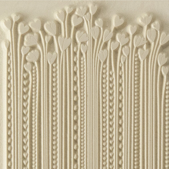 Texture Tile - Hearts in Bloom. Beige Texture Tiles are flexible, washable and can be used with any soft clay. Spritz with CoolSlip or dust on Dry Powder Release for stick-free impressions when using metal clay and polymer clay.