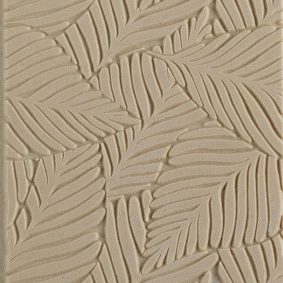 Texture Tile - Palm Leaves. Beige Texture Tiles are flexible, washable and can be used with any soft clay. Spritz with CoolSlip or dust on Dry Powder Release for stick-free impressions when using metal clay and polymer clay.